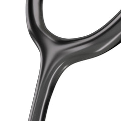 A black medical stethoscope with a metallic silver chestpiece and white ear tips, displayed on a clean white reflective surface. The chestpiece features the brand name 'MDF' printed on it.